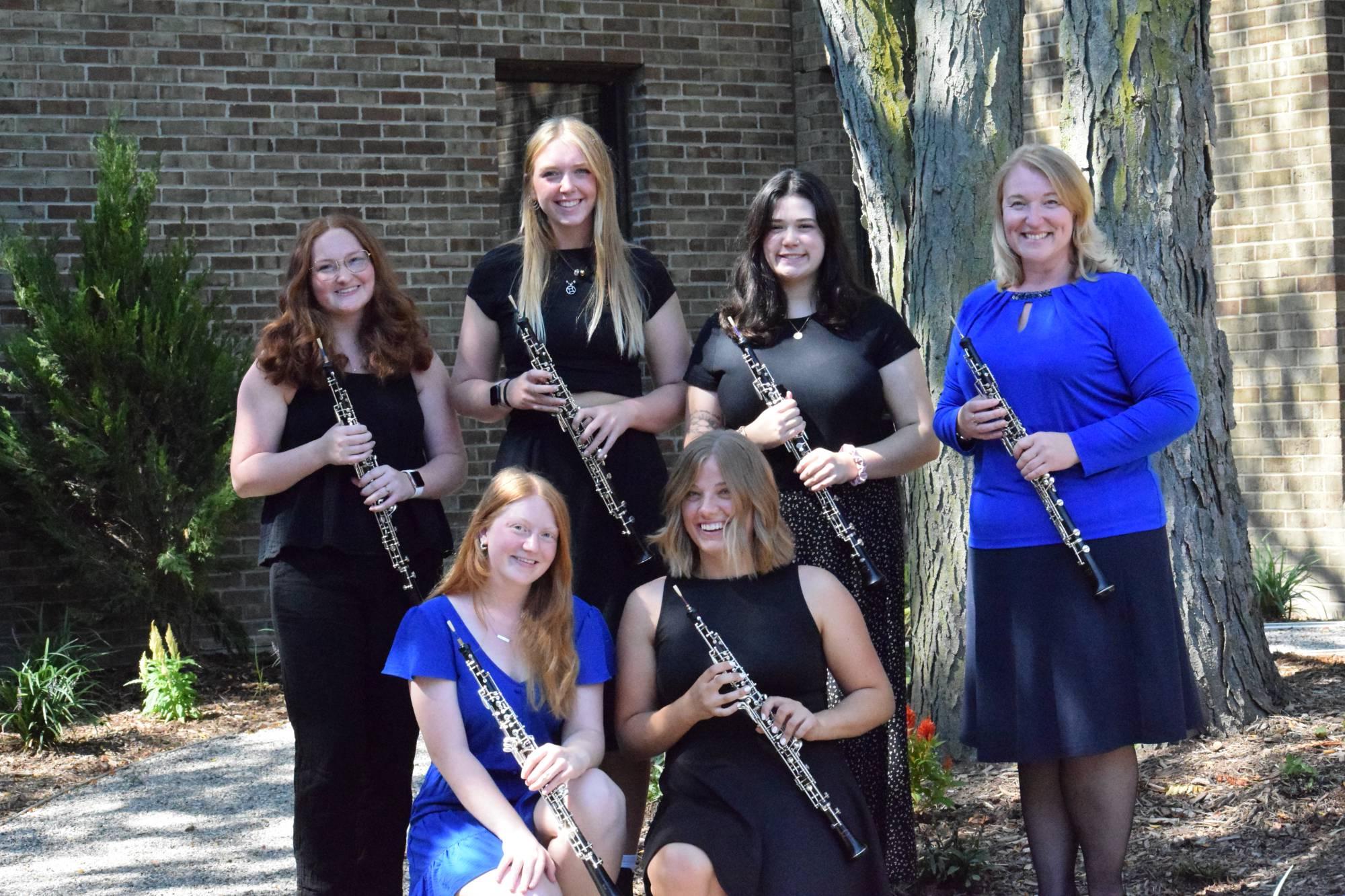 GVSU Oboe Studio standing in two rows. From left - top: Marlen Vavrikova, Lea Carter, lauren Schnicke, Natalie Kline; From left - bottom: Natalie Feldpausch, Joy Anderson